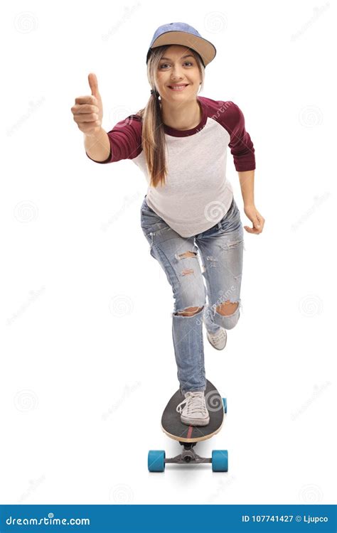 Female Skater Riding A Longboard And Making A Thumb Up Gesture Stock