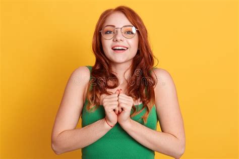 Delightful Red Haired Girl In Spectacles And T Shirt Sees Something