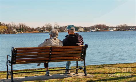 Couple Sitting On Bench Overlooking Water Photograph By David Wood Pixels