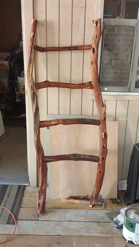 rustic quilt ladder made from manzanita branches for a rustic wedding rustic quilts quilt