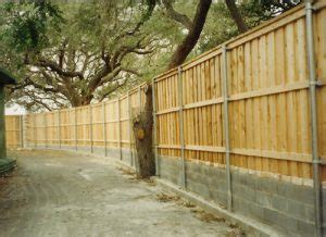 Before you stick them down into the ground, you need to apply stain. Commercial Wood Privacy Fences - Installation, Repair and ...