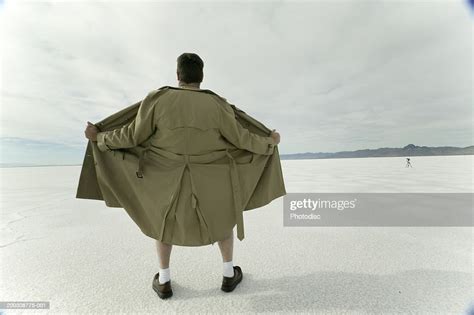 Exhibitionist Spreading Open Coat In Desert Photo Getty Images