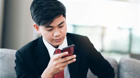 Premium Photo Young Businessman Using Mobilephone App Texting Outside