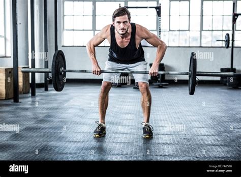 Fit Man Lifting Heavy Barbell Stock Photo Alamy