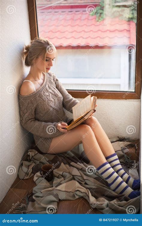 Young Beautiful Woman In A Sweater Reading Stock Image Image Of Indoors Indoor 84721937