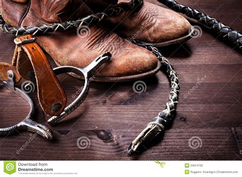 Cowboy Bootswhip And Spurs On Wood Stock Photo Image