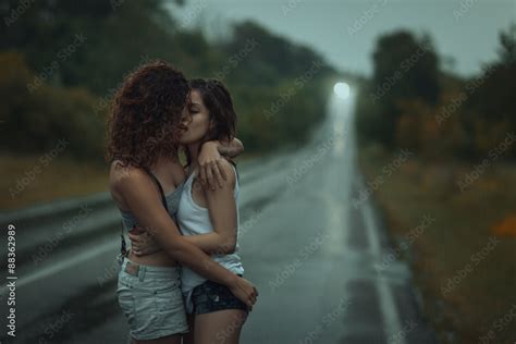 Girls Lesbians Kissing Under The Heavy Rain Stock Photo Adobe Stock