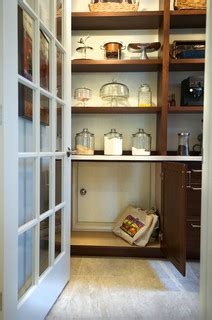 I would borrow some room from the storage room to make a pantry and have a door to the pantry from breakfast. Walk-in Pantry