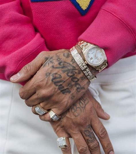 Let me get a flick wit'chu come on, lil' bro got your camera? Nipsey Hussle's 31 Tattoos & Their Meaning - Body Art Guru