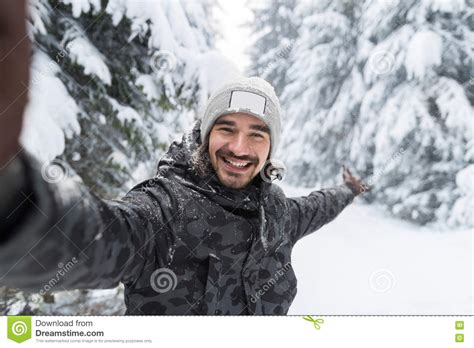 Young Man Smile Camera Taking Selfie Photo In Winter Snow