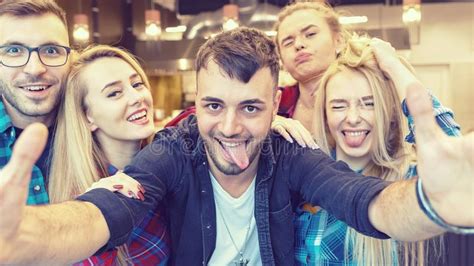 Millennial International Best Friends Taking Selfie With Funny Faces At Party Stock Image