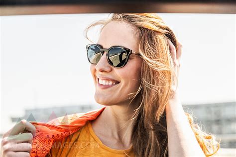 Portrait Of Smiling Woman Wearing Sunglasses