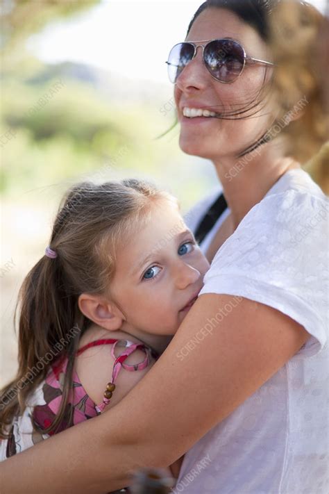 Mother Hugging Daughter Outdoors Stock Image F0043599 Science