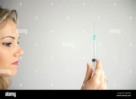 Syringe Medical Injection In Hand Palm Or Fingers Medicine Plastic