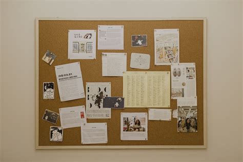 A Bulletin Board Covered In Papers And Pictures Photo Free Bussiness