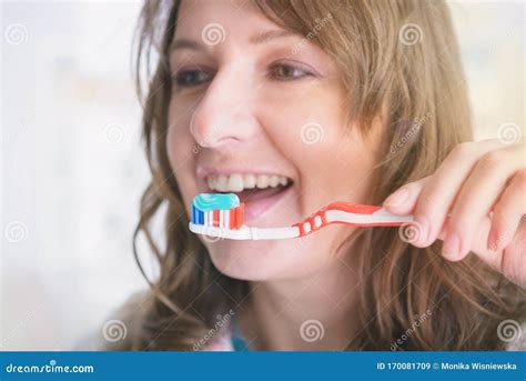 Smiling Woman Holding Toothbrush Stock Image Image Of Paste Bathroom