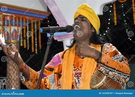 A Folk Singer Performing Folk Songs With His Local String Instrument