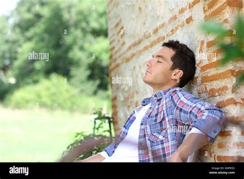 Man Relaxing On Bench During Week End In Countryside Stock Photo Alamy