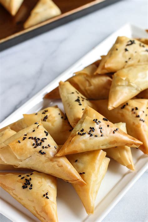 Maybe you would like to learn more about one of these? Spinach & Artichoke Stuffed Spanakopita Triangles | Recipe ...