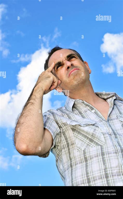 Portrait Of Middle Aged Man Thinking Hard Stock Photo Alamy