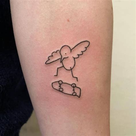 Bird Skateboarding Tattoo On The Inner Forearm