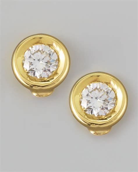 Gold is the ideal precious metal for earrings, and the diamonds are arranged to represent floral designs, or enthoned on a golden stem in complete simplicity. Roberto Coin 18k Yellow Gold Diamond Solitaire Stud Earrings in Gold | Lyst