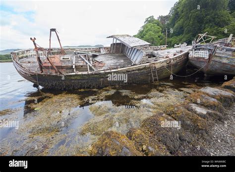 Two Abandoned Fishing Boats On The Shore Of Salen Bay Isle Of Mull