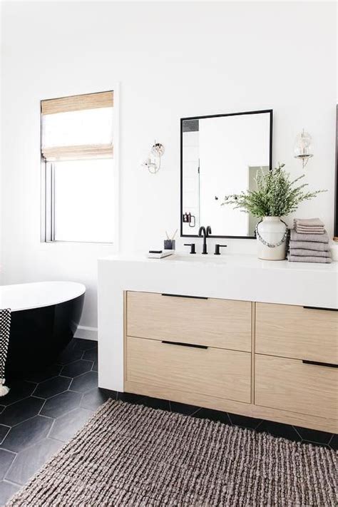 Have you had any issues with marks from hot objects? White quartz waterfall countertop on a light oak veneer ...