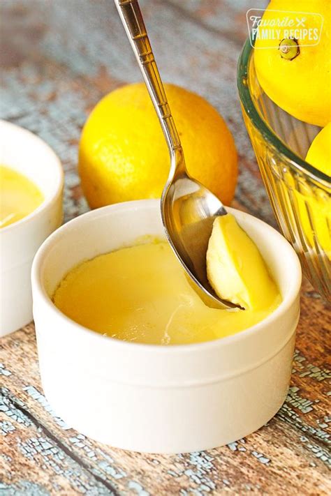 Instant Pot Lemon Custard Being Scooped From A White Custard Dish With A Spoon Instant Pot
