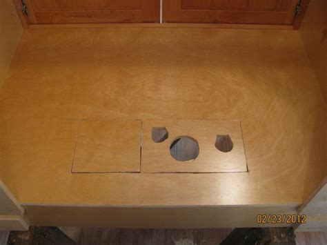 Two screws on the cabinet side allow the door to move up or down. Log Home Pictures from 2012, Part 2 of 4