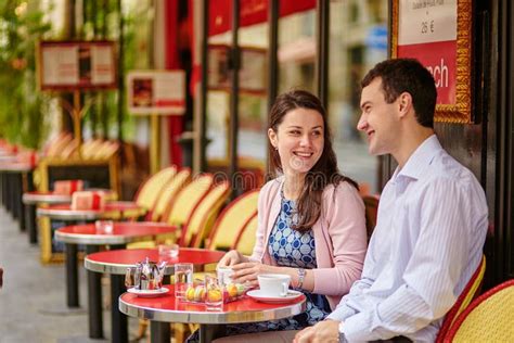 Couple Drinking Coffee Or Tea In A Parisian Cafe Stock Image Image Of