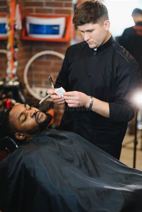 Visiting Barbershop African American Man In A Stylish Barber Shop