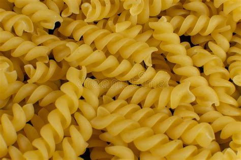 Background Formed By Spiral Shaped Pasta Texture Stock Photo Image