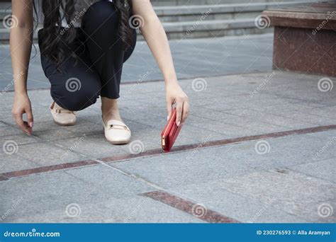 Woman And A Wallet On The Ground Stock Image Image Of Footpath Hand
