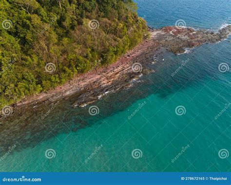 Aerial Drone View Of Beautiful Beach With Turquoise Sea Water And Palm