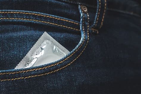 premium photo world aids day men hold condoms before having sex