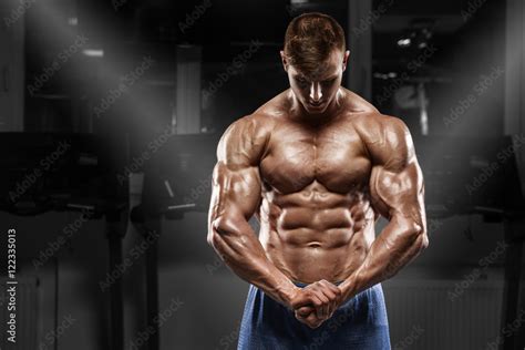 Sexy Muscular Man Posing In Gym Shaped Abdominal Showing Muscles