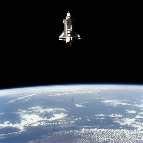 The Earth Orbiting Space Shuttle Challenger Beyond The Earths Horizon