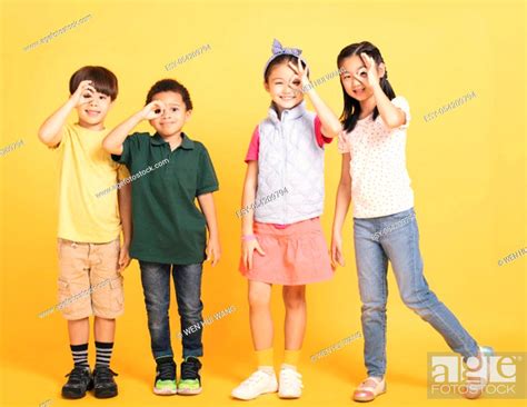 Happy School Children Stanging Together Stock Photo Picture And Low