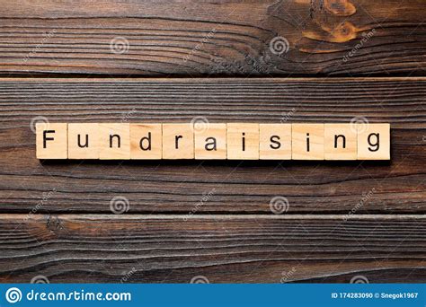 Fundraising Word Written On Wood Block Fundraising Text On Table