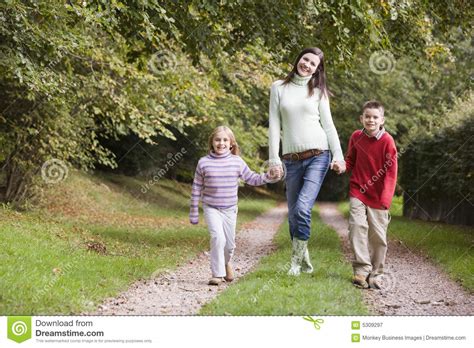Mother And Children Walking Along Woodland Path Stock Image Image Of