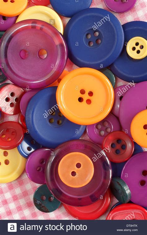 Pile Of Brightly Colored Buttons Used In Sewing And Haberdashery Stock