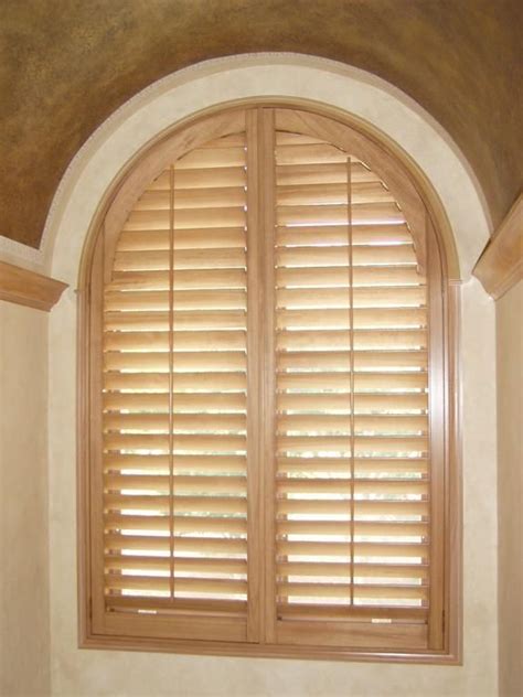 Another red brick home with dark gray exterior shutters. arched shutters in wood | Arched windows, Arched window ...