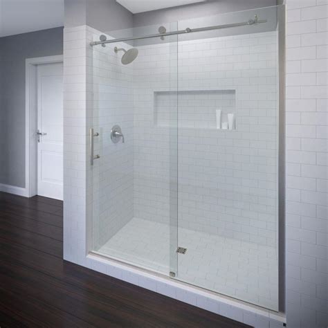 A fixed glass shower door uses panels to cover the open sides of a bathtub. Basco Vinesse 47 in. x 76 in. Semi-Frameless Sliding ...