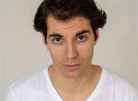 Natural Portrait Of Young Attractive Man In His 20s Looking And Posing