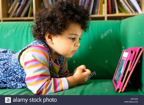 Toddler Using An Ipad At Home Stock Photo Alamy