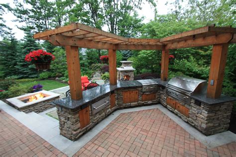 Pergola Over An Outdoor Kitchen By The Pattie Group Outdoor Spaces