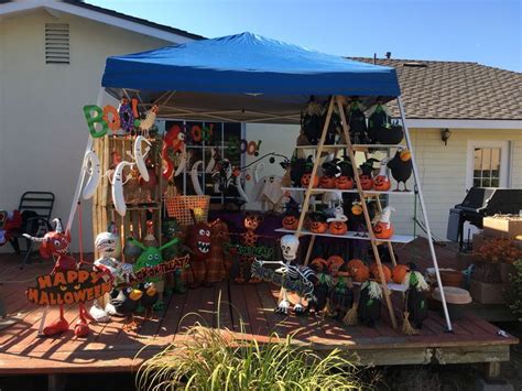 An Outdoor Display With Pumpkins And Decorations