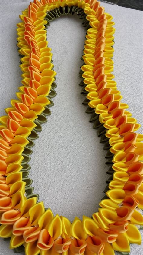 Diy braided hawaiian ribbon lei (super easy with video!) discover how to make an easy hawaiian ribbon lei. Pin by Saurbhi ..... on Artificial flower Garland | Ribbon lei, Graduation leis, Diy graduation ...