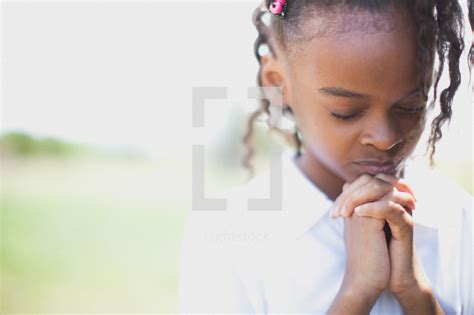Young African American Girl With Praying Hands — Photo — Lightstock